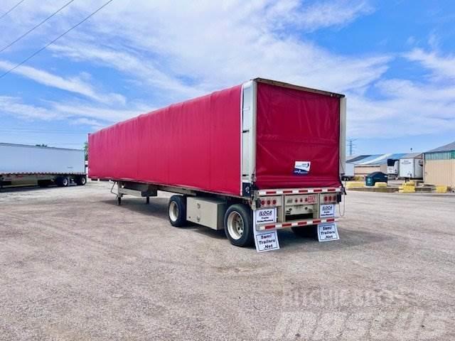 East Mfg FLATBED WITH ROLLING TARP Tautliner/curtainside trailers